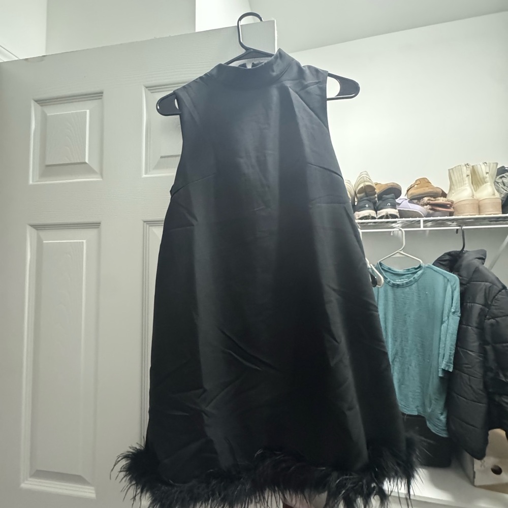 Chic Black Dress with Feather Hem